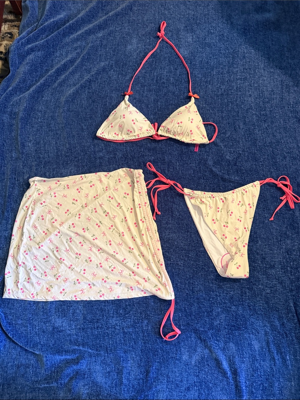 Adorable, sexy Betsy Johnson three piece string tie bikini and cover up skirt.